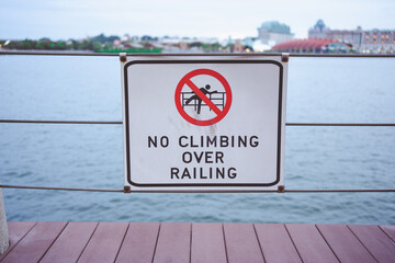 Sign Climbing over falling in Singapore.