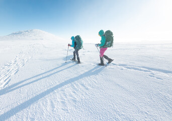 Fototapeta na wymiar Winter mountain hiking in snowshoes