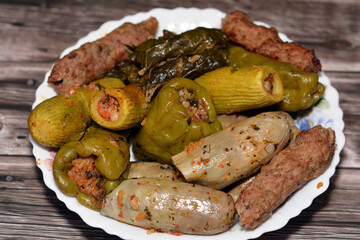 Stuffed squash zucchini Mahshi, eggplants, wrapped grape leaves, bell peppers filled with white...