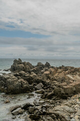 Fototapeta na wymiar Rock formations in ocean cove