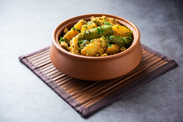 Aloo Potol or Dalna Recipe is a traditional sabzi from bengal made with potato & pointed gourd