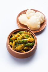 Aloo Patol sabzi made using pointed gourd and potato served with fried Luchi or poori, Bengali food