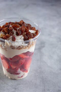 A view of a cup of fresas con crema, which is a strawberries and cream parfait.