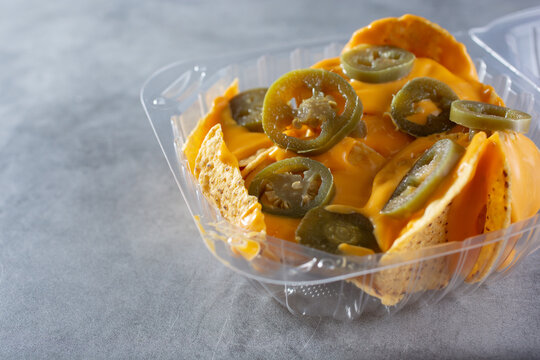 A view of a container of nachos.