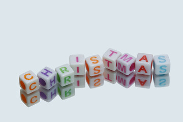 Christmas letter symbol with reflection,