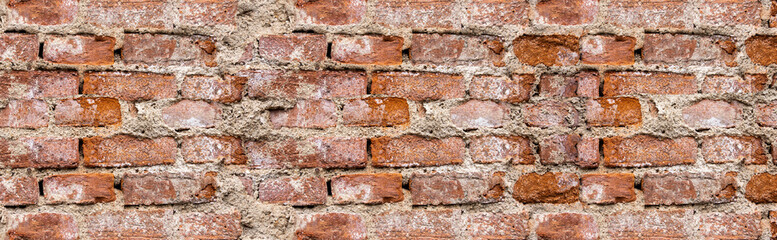 Faktura starego ceglanego muru z naturalnymi ubytkami. old brick wall
