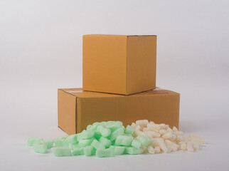 corrugated parcel boxes with shockproof bubbly plastic protective granules on white background