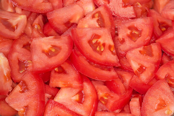 Slices of the red tomatoes, top view close-up