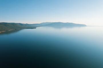 Summertime imagery of Lake Baikal is a rift lake located in southern Siberia, Russia Baikal lake summer landscape view from a cliff near Grandma's Bay. Drone's Eye View.