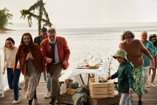 Family having lunch on pier