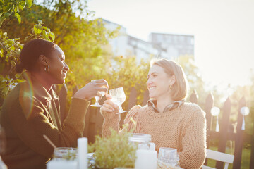 Female friends having meal in garden