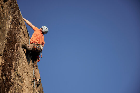 Rock climber reaching top