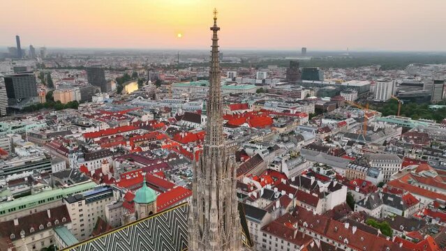 Vienna aerial skyline at sunset. Stephen's Cathedral, flying above Vienna, capital of Austria, famous tourist landmark of gothic cathedral in the city centre