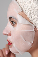 Facial skin care, portrait of a young woman with a mask on her face.