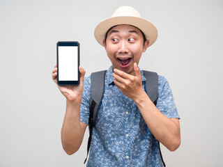 Traveler asian man show mobile phone and feels excited about booking at holiday isolated