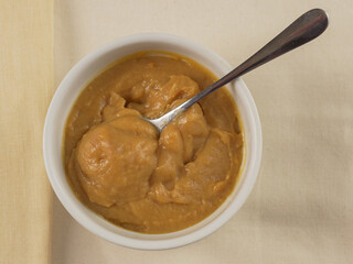 Butterscotch pudding in white ramekin