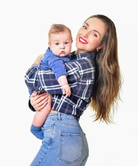 Mother and baby playing and smiling. Happy family.
