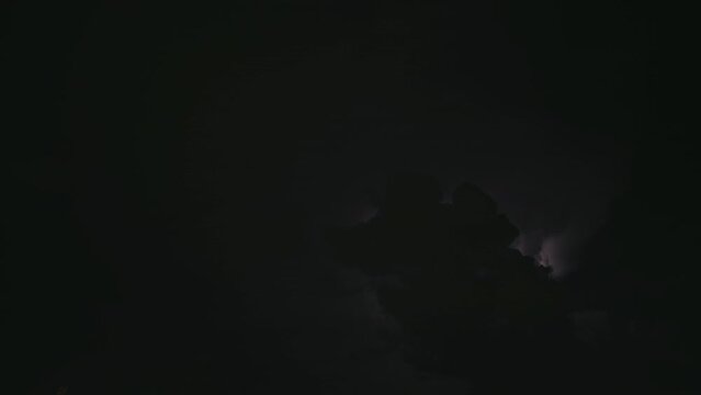 Thunderstorm in the clouds at night time lapse 