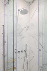 Fototapeta na wymiar Chrome shower in the shower room interior