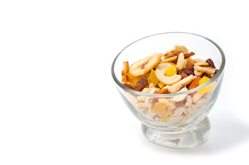 Fruit and nut assortment of peanuts, raisins, pineapple, almonds, cashews and bananas.