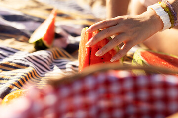 Cheerful young woman enjoy at tropical sand beach. Portrait of happy girl with fruit