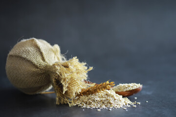 World grain crisis. A handful of cereals and on a dark background.