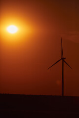 Obraz premium Windmill farm park and turbines for producing green electricity.