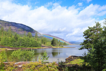 A rainbow over the lake Skredvatn, Fyresdal - South Norway