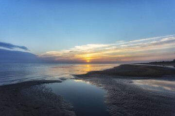 Fototapeta premium Beautiful cloudscape over the sea, sunrise shot