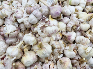 A close-up view of garlic in a store.