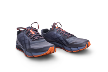 A front view of grey and orange trainers, sneakers Isolated on a flat background.