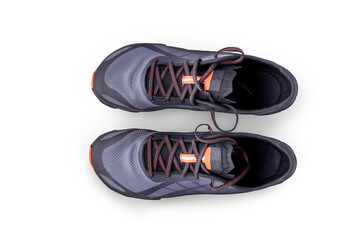 A top view of grey and orange trainers, sneakers Isolated on a flat background.