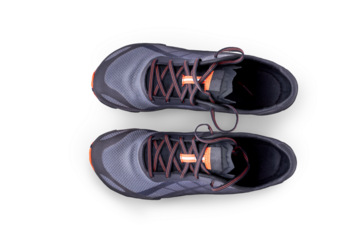 A top view of grey and orange trainers, sneakers Isolated on a flat background.