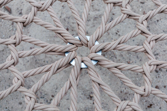 Round Swing Seat Made Of Mesh In The Snow. View From Above.