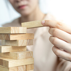 Planning to reduce investment risks, plan and strategy in business, Establishing a business risk mitigation plan to create stability for the company, Business growth with wooden blocks concept.