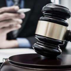 Judge or a lawyer works documents in the courtroom and analyze the various laws for justice and accuracy, Litigation and justice concept.