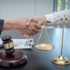 Lawyers or attorneys shake hands to congratulate the clients who have proceeded the matter with...