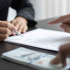 Businessmen give dollars to bribe employees in signing contracts to buy illegal land and real...