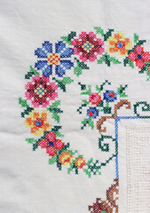 Vintage table cloth close up photo. Beautiful embroidery pattern. 