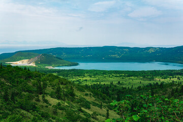 landscape of Kunashir Island, geothermal lakes among lava domes in the center of Golovnin volcano caldera