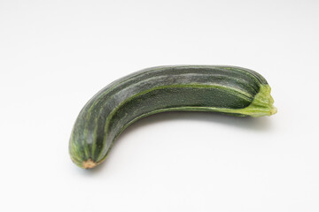 Green crooked squash on a white background