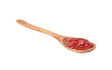 Ketchup in wooden spoon isolated on white