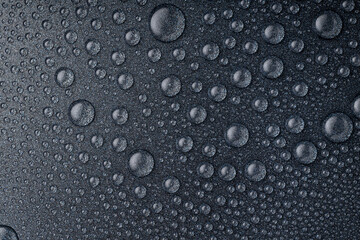 Small drops on a heat-resistant gray surface