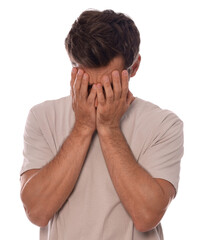 Fototapeta premium Upset man covering face with hands on white background