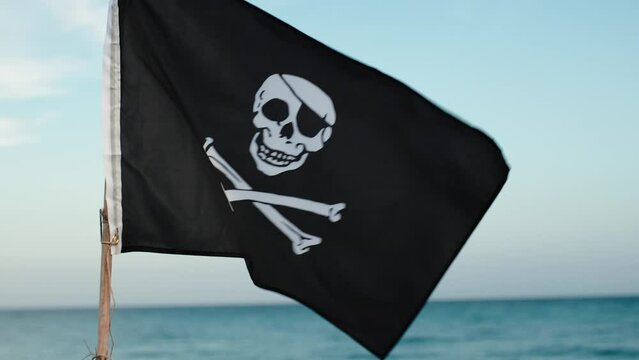 Pirates Flag Weaving On Blue Sky 