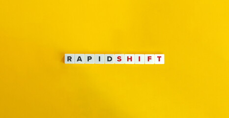 Rapid Shift Phrase on Block Letter Tiles on Yellow Background. Minimal Aesthetics.
