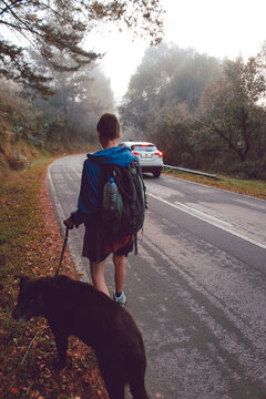Woman walking with dog in nature