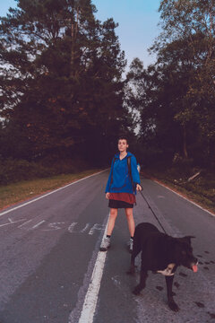 Woman walking with dog in nature