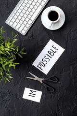 Change your life concept. Impossible cutting into Possible with scissors