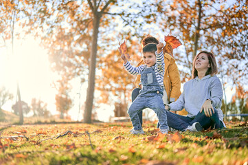 Lesbian family with son in autumn park